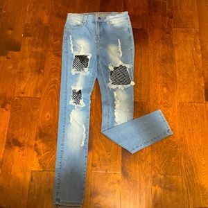 Skinny blue jeans with black mesh on both sides